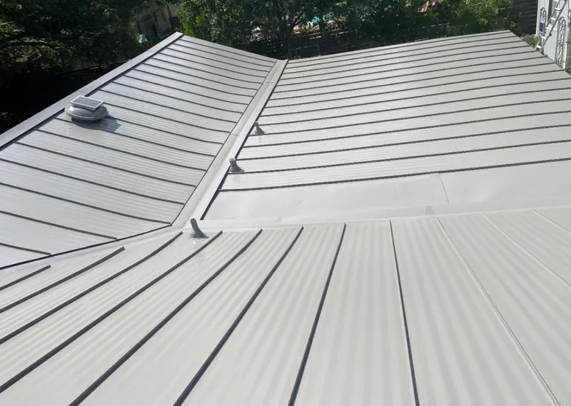Solar attic fan installed on a metal roof for Roof Ventilation in Cave Spring